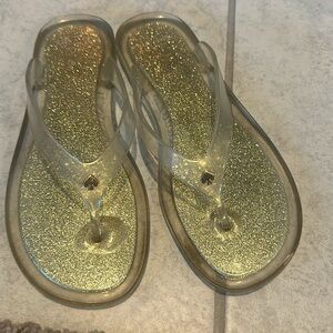 Kate Spade gold sparkling thong scandals.